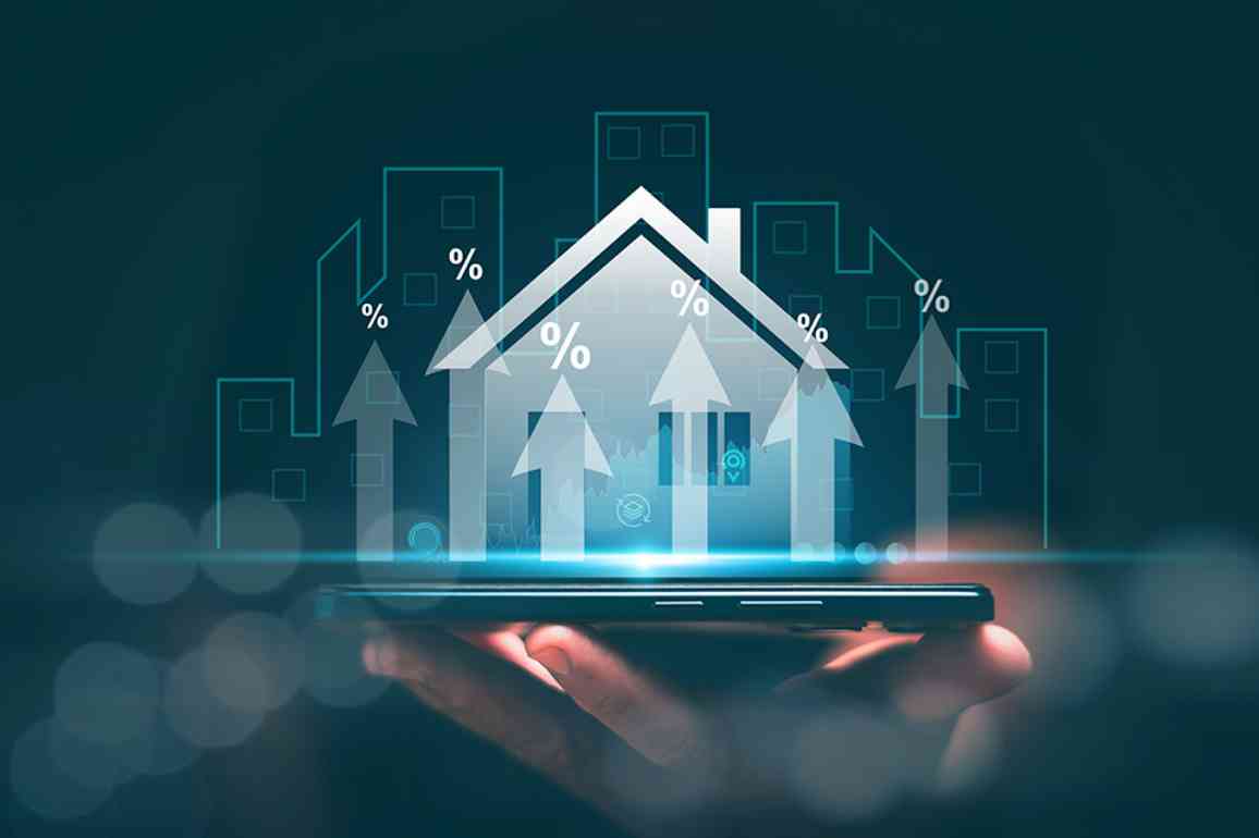 Hologramm eines Hauses auf einer Hand